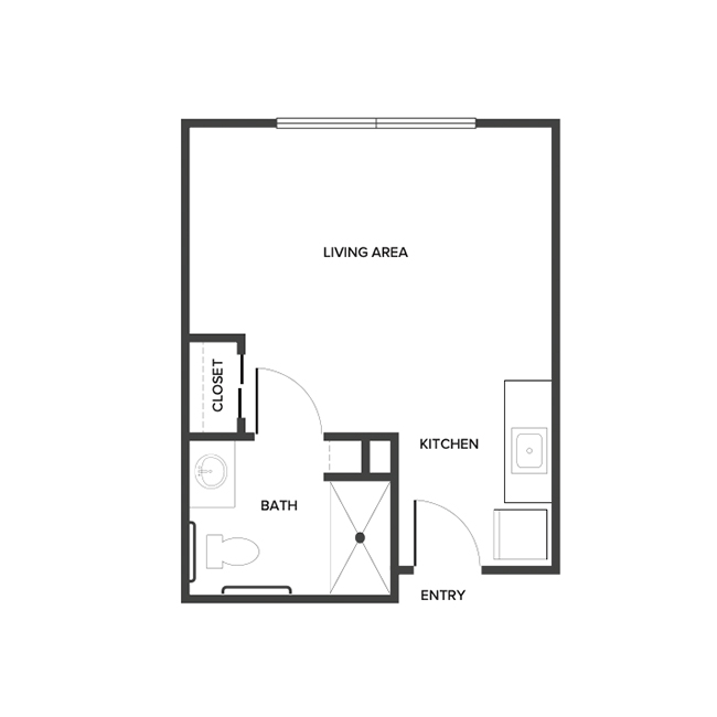 An assisted living studio floor plan with an open living/bedroom space and kitchenette.
