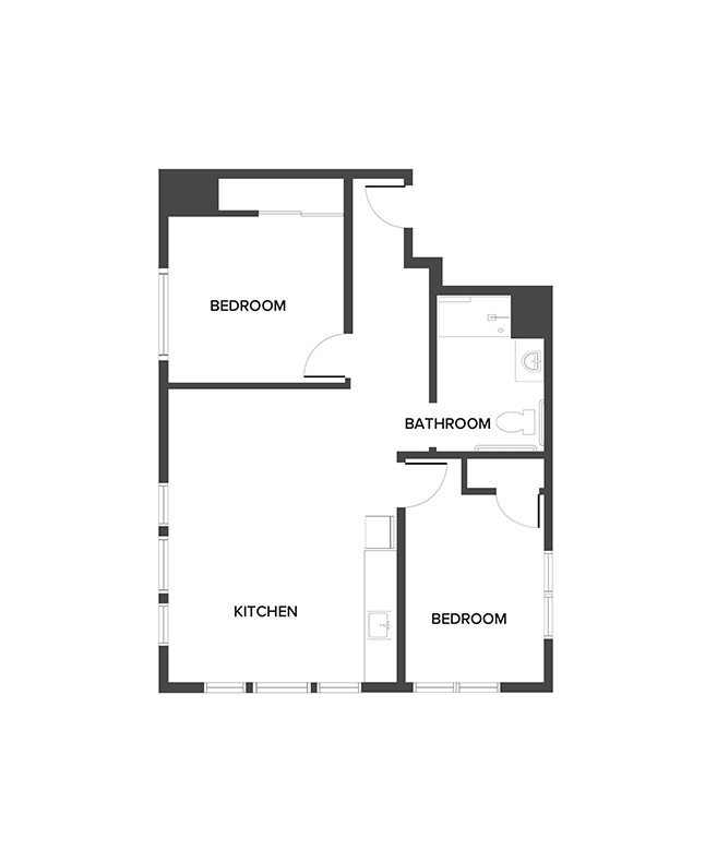 An assisted living suite floor plan with two bedrooms and a bathroom.