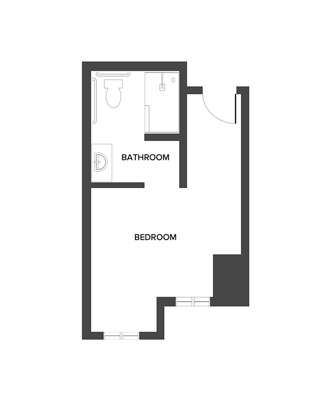 A memory care studio floor plan with a bedroom space and bathroom.