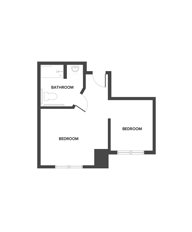 A memory care shared suite floor plan with two bedrooms and a bathroom.