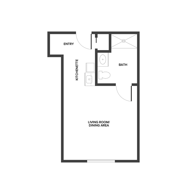 An assisted living studio suite floor plan with an open living/bedroom space and kitchenette.