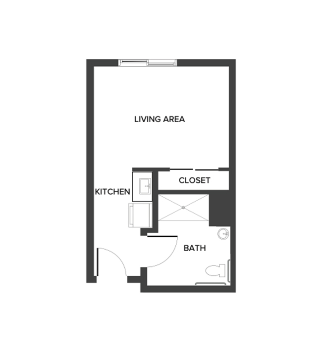 An assisted living studio suite floor plan with an open living/bedroom space and kitchenette.