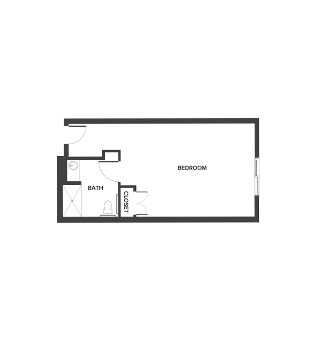 A memory care studio floor plan with an open living space and a bathroom.