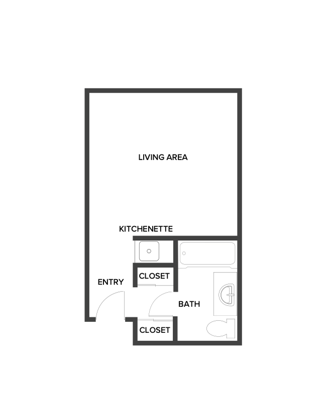 An assisted living studio suite floor plan with an open living/bedroom space and kitchenette.