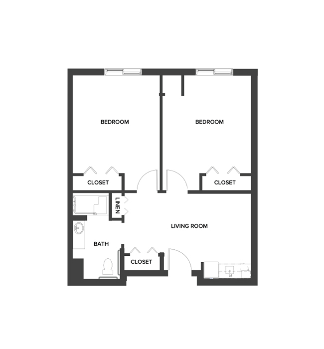 An assisted living shared suite floor plan with two bedrooms, a living room and kitchenette.