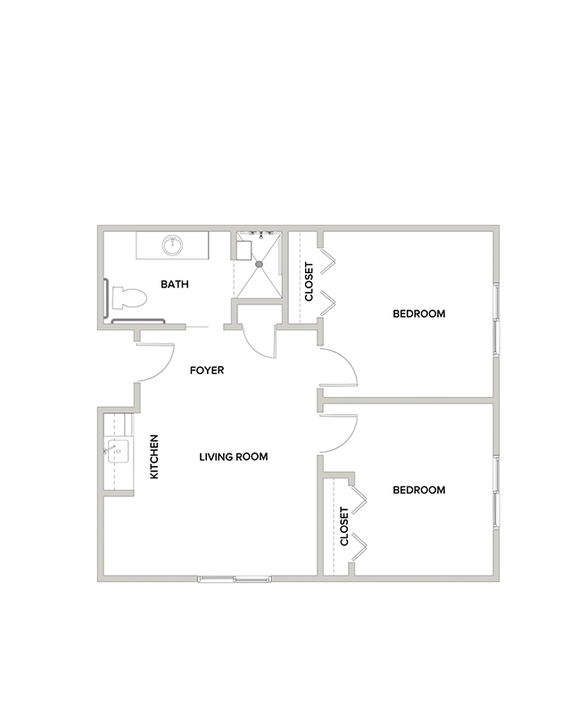 An assisted living suite floor plan with two bedrooms and a bathroom.