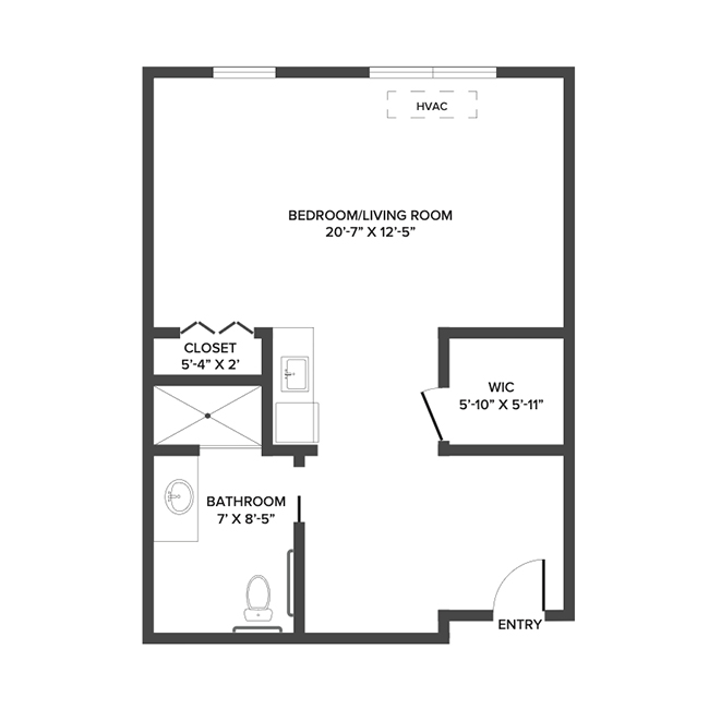 An assisted living studio suite floor plan with an open living/bedroom space and kitchenette.