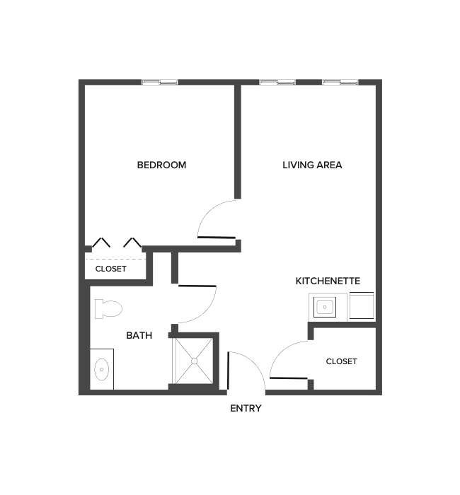 An assisted living suite floor plan with two bedrooms and a bathroom.