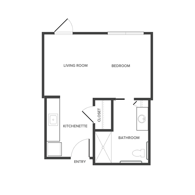 An assisted living studio suite floor plan with an open living/bedroom space and kitchenette.