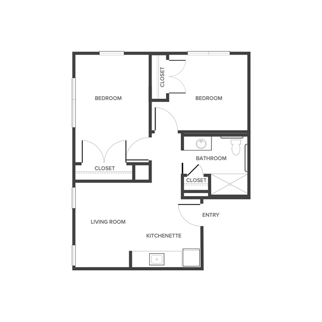 An assisted living suite floor plan with two bedrooms and a bathroom.