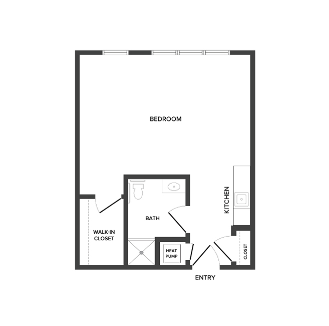An independent living studio floor plan with an open living/bedroom area, kitchenette and walk in closet.