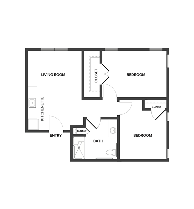 An assisted living suite floor plan with two bedrooms and a bathroom.