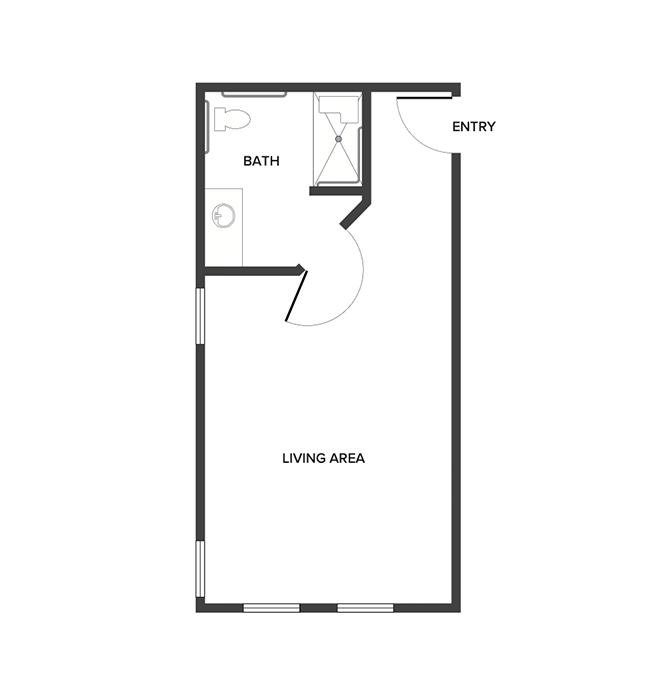 A memory care studio suite floor plan with an open living/bedroom space and a bathroom.