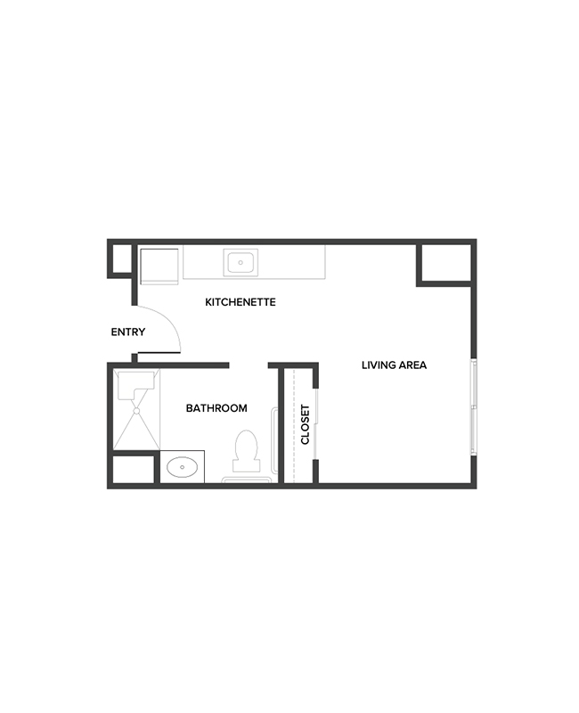An assisted living studio suite floor plan with an open living/bedroom space and kitchenette.