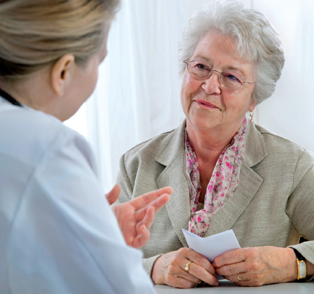 A person talking to a doctor.