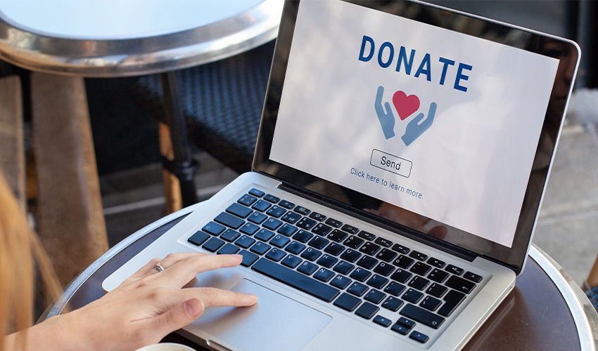 A laptop computer with a donate screen.