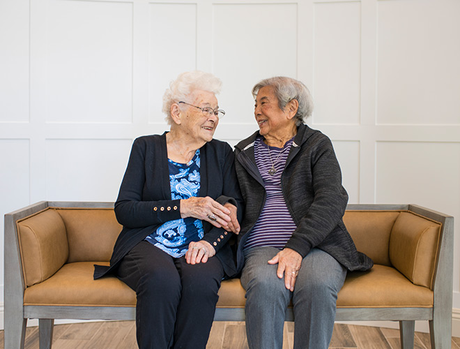 Two residents are sitting next to eachother.