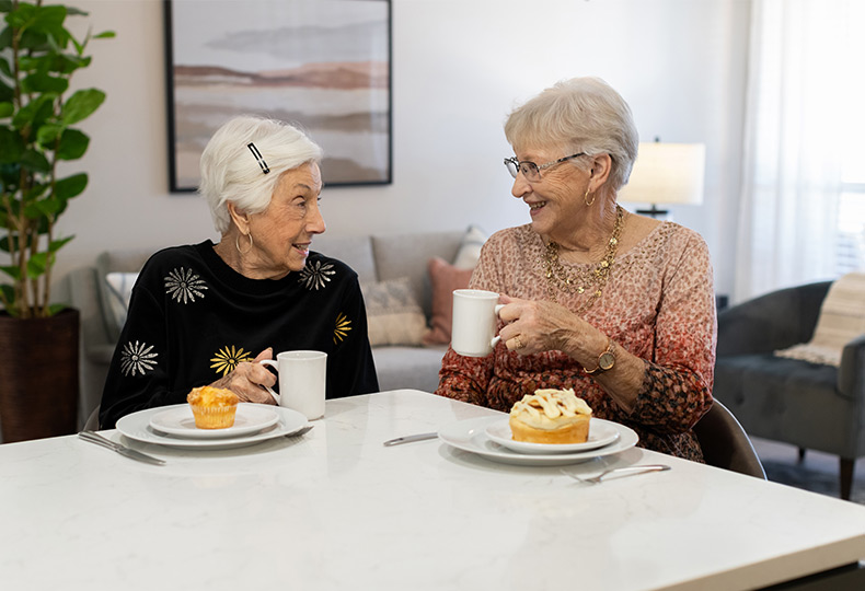 Two friends having breakfast together.