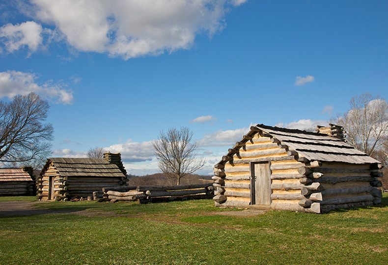 Two log cabins outside