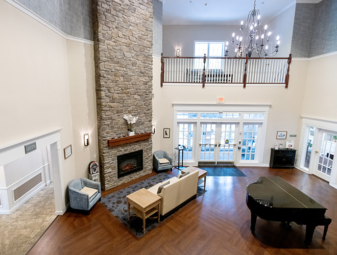 The lobby with a front desk and seating.