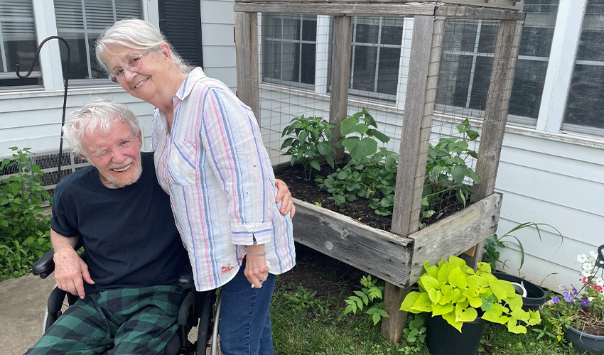Two people outside in the garden.