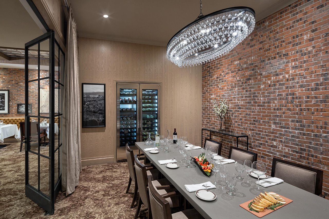 The Watermark at Brooklyn Heights dining private room area with seats and a long table.
