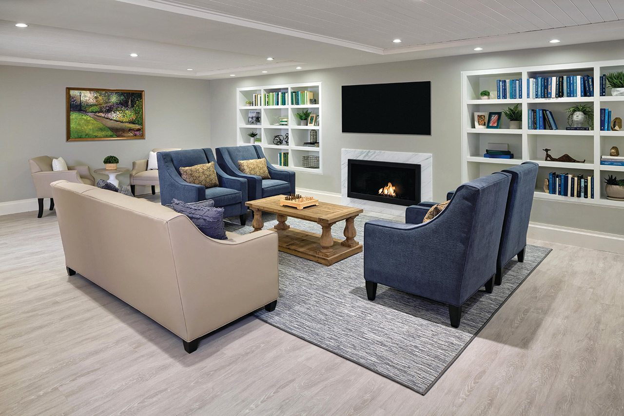 Living room space with sofas facing a fireplace.