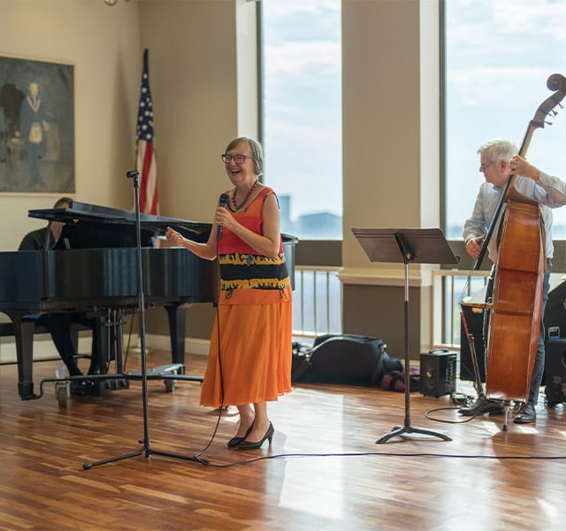 Residents playing instruments and singing.