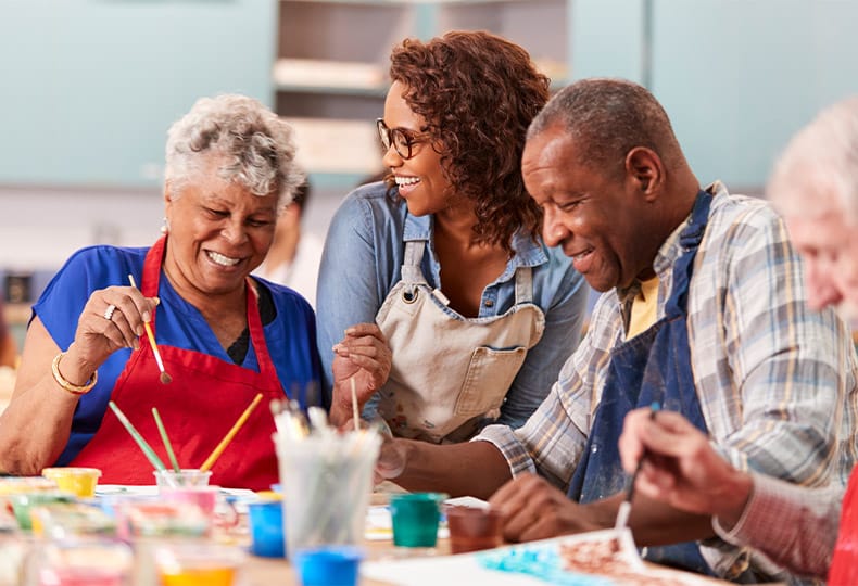 Residents enjoying a painting class.