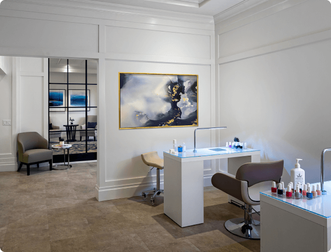 Salon and spa featuring tables and mirrors.