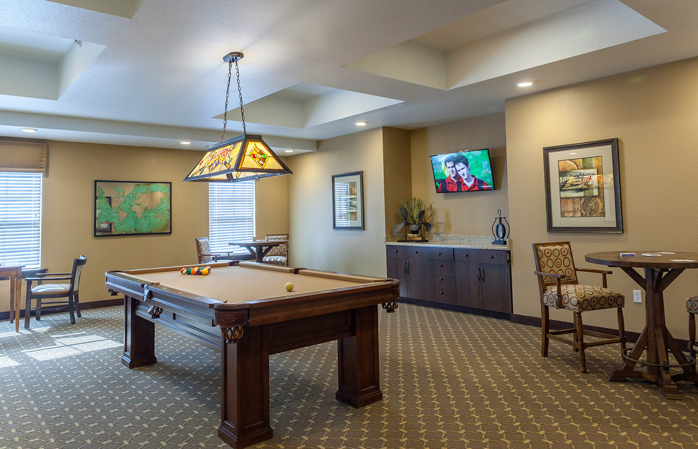 A table and various other amenities in the Billiard Room.