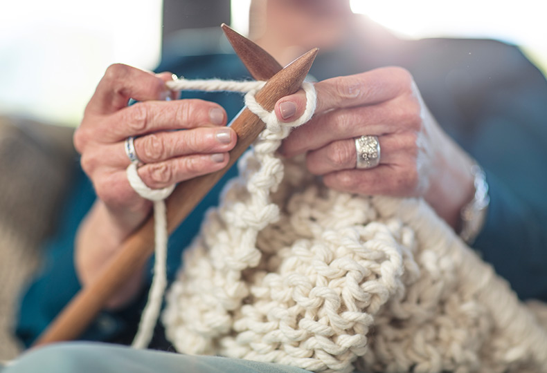Resident is knitting.