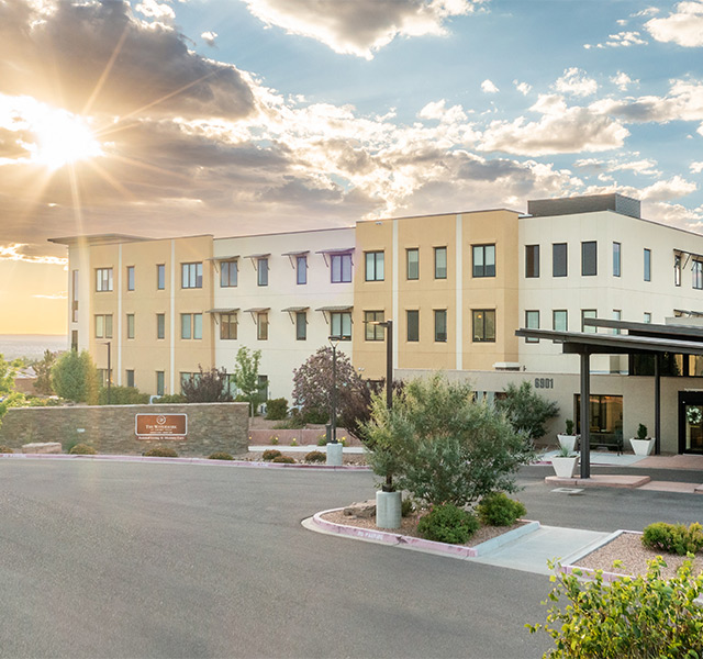 The building exterior at sunset.