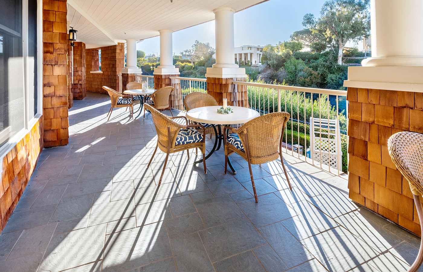 Dining tables and chairs on patio.