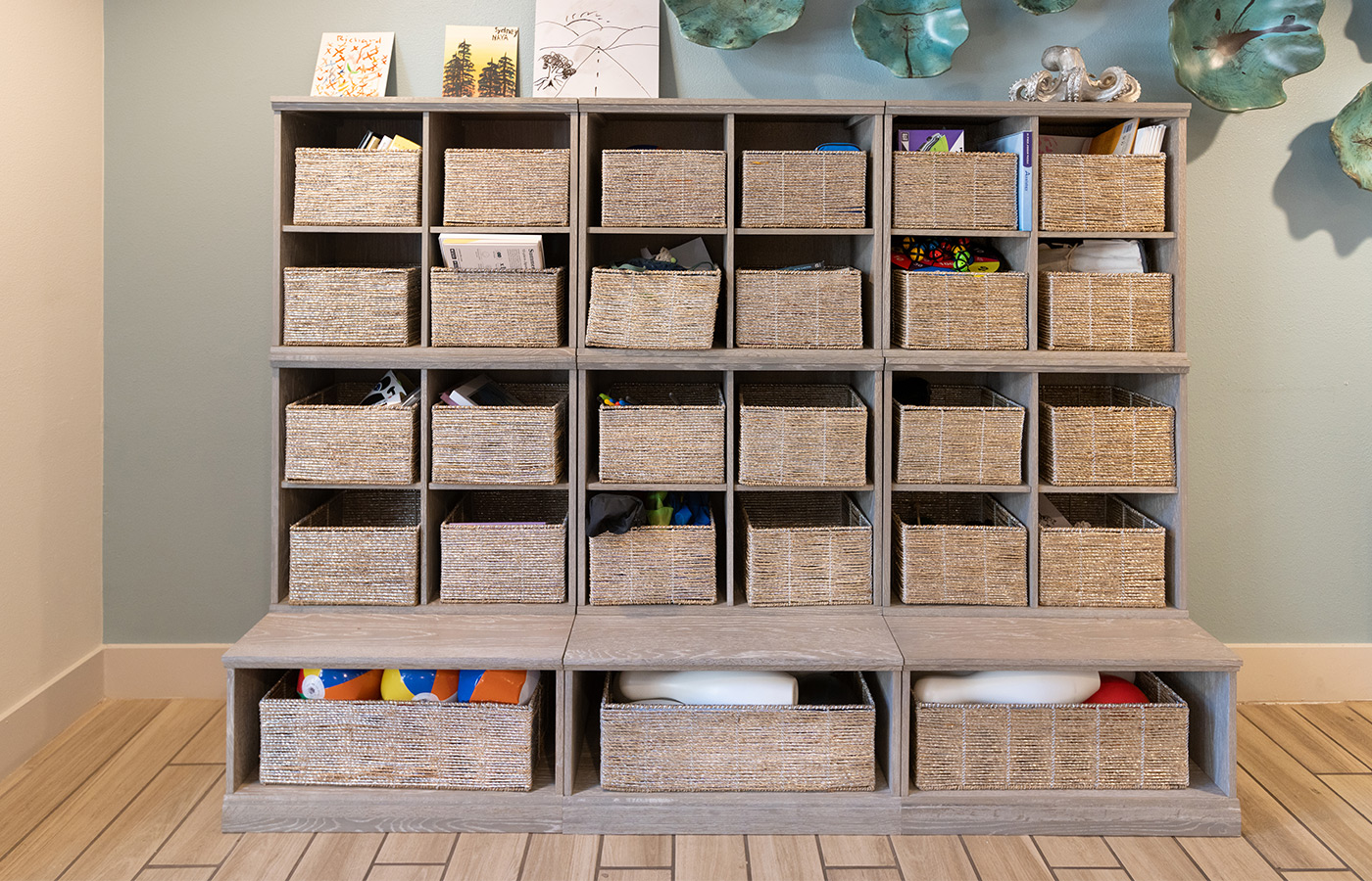 A shelving unit consisting of multiple baskets.