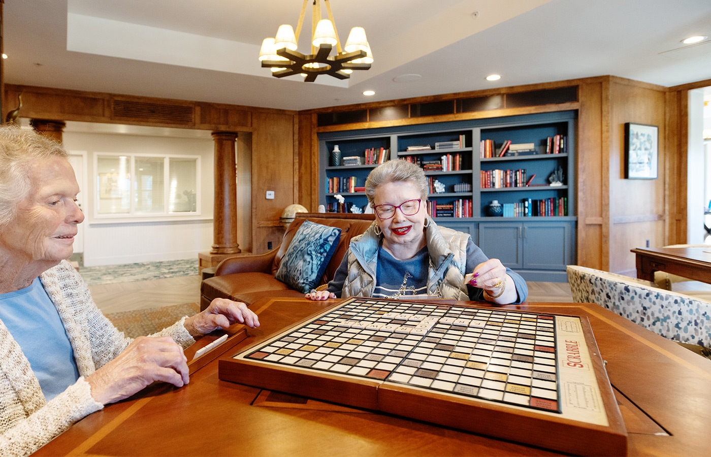 Two residents playing Scrabble.