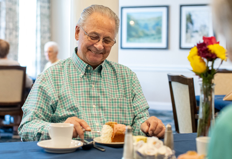 A resident is having breakfast.