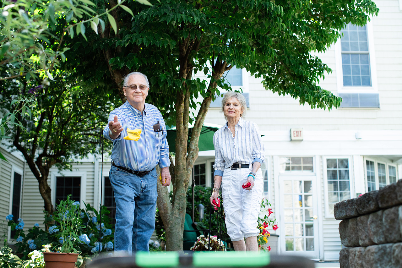 Residents are playing games in the courtyard.