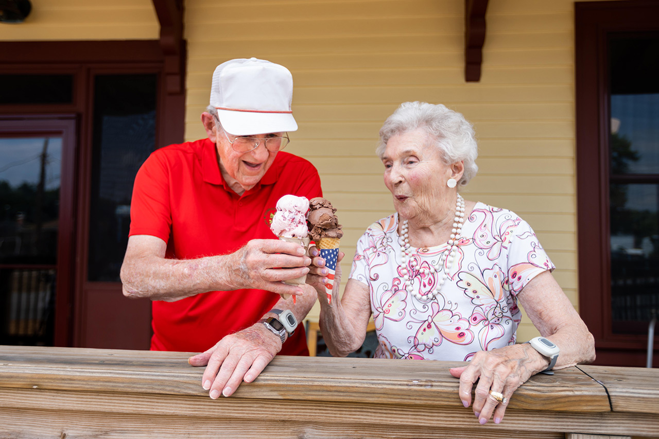 Two residents are having ice cream. 