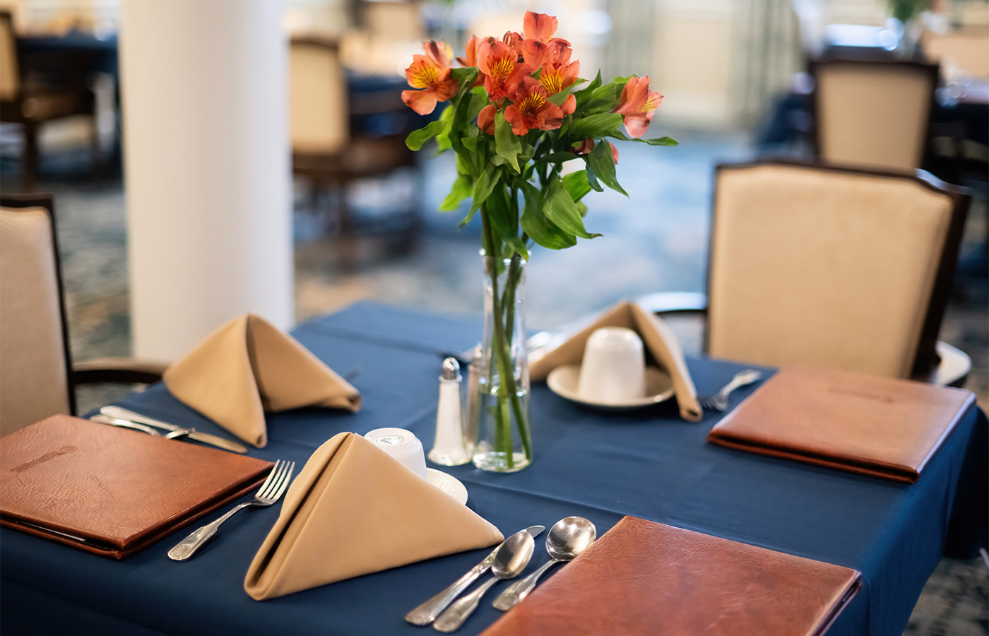 A dining table with menus.