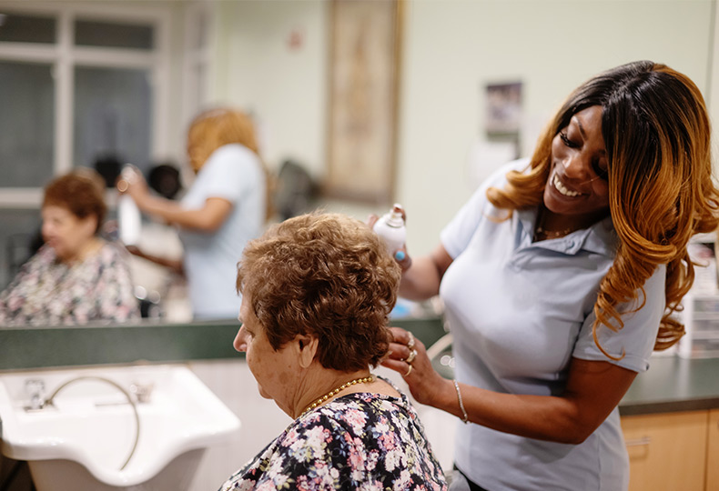 A person getting their hair styled at the salon.