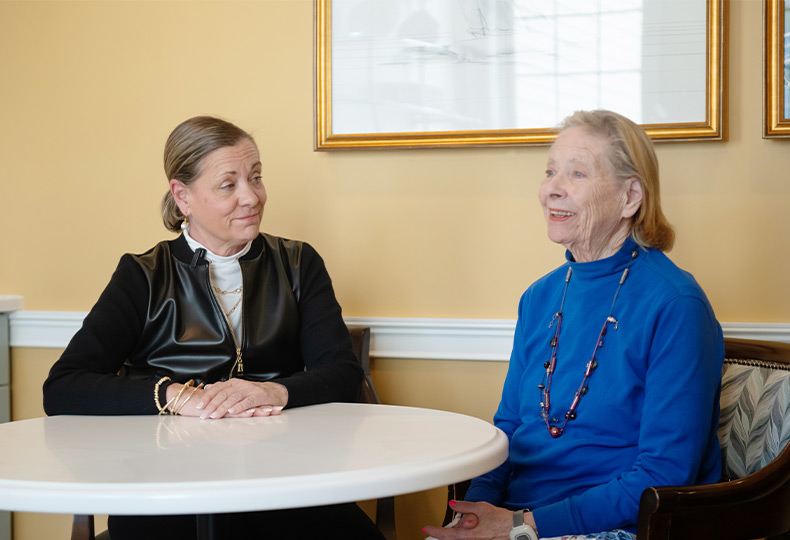 Two people sitting at a table.