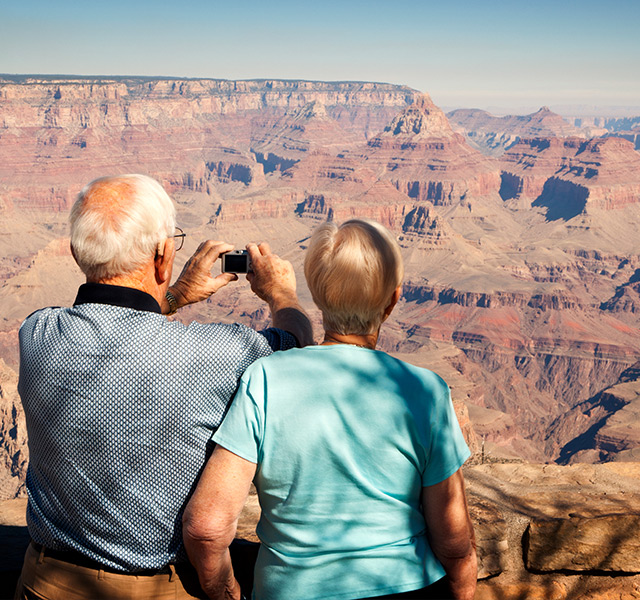 Two people are at the Grand Canyon.
