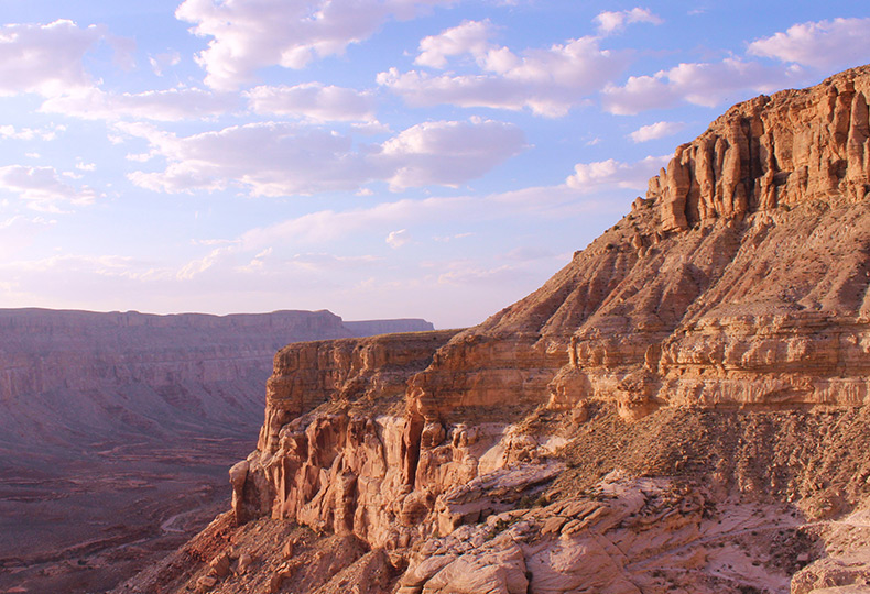 Side of a canyon and blue skies.