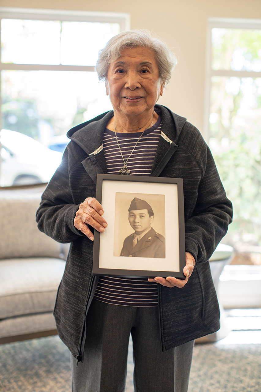 Resident holds a picture in hands.