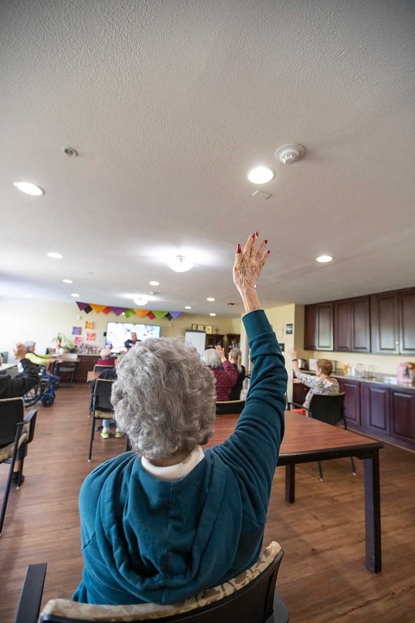 Residents participate in tai chi.