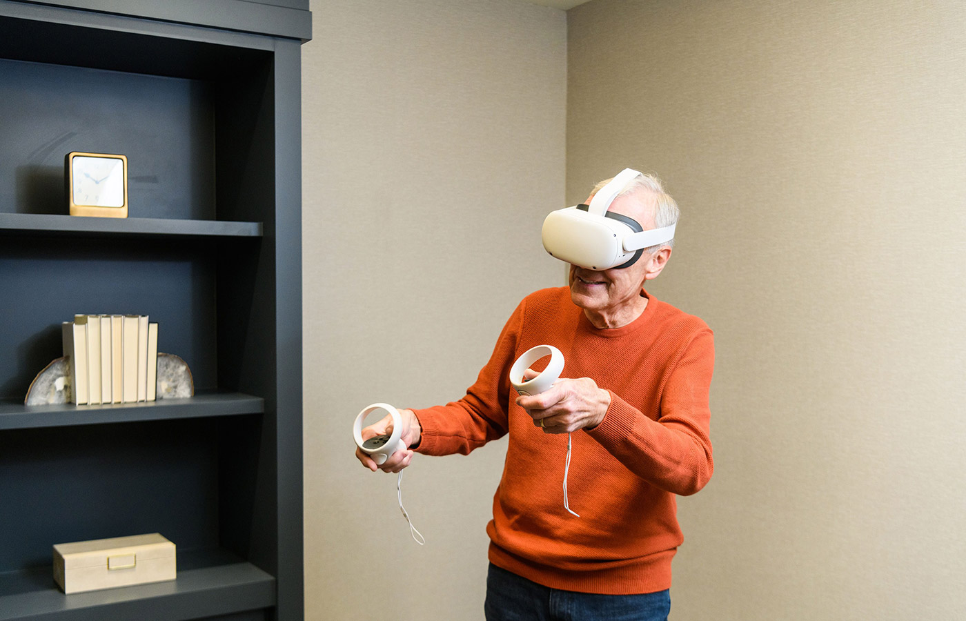 A resident is using the Engage VR set.