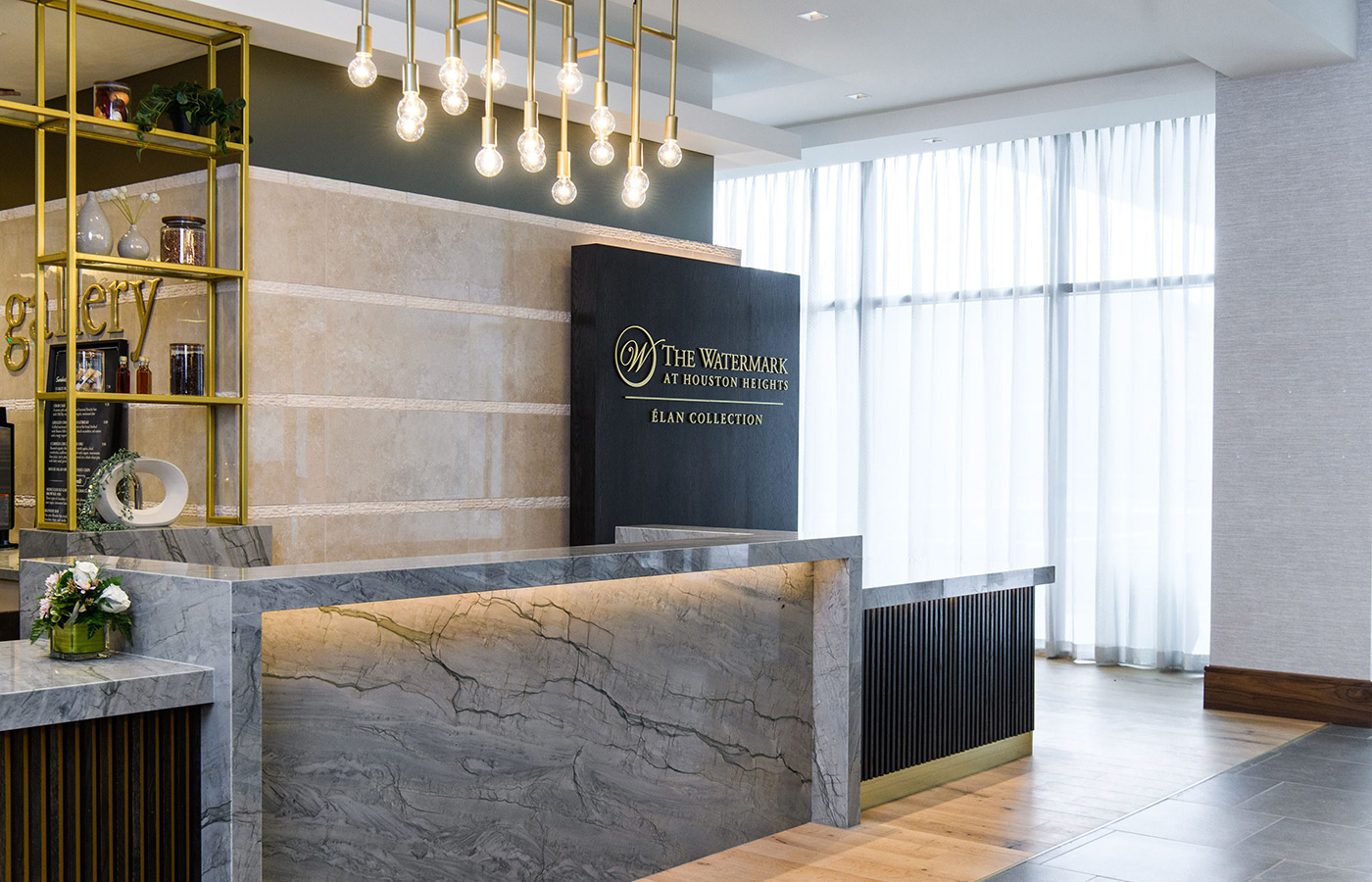A marble front desk in lobby.