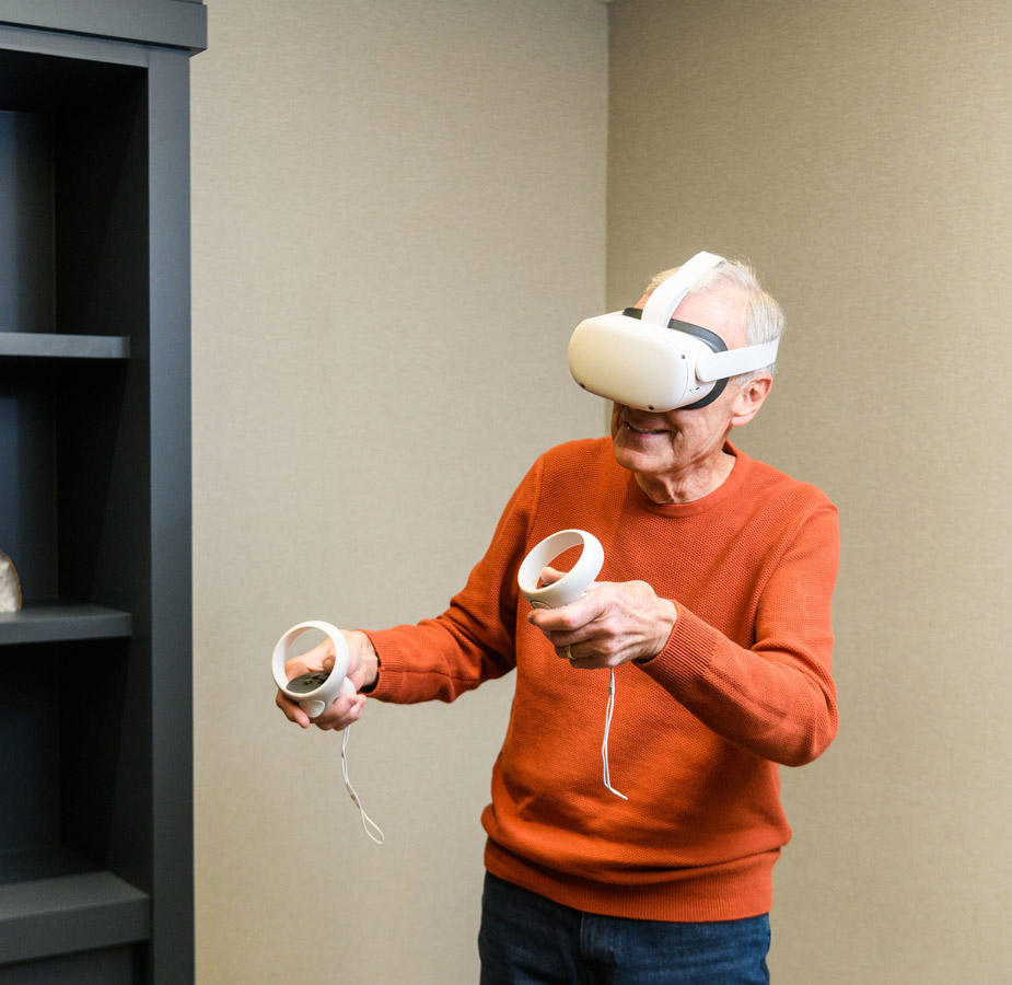 A resident is using the Engage VR set.