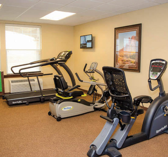 A gym with three different machines.